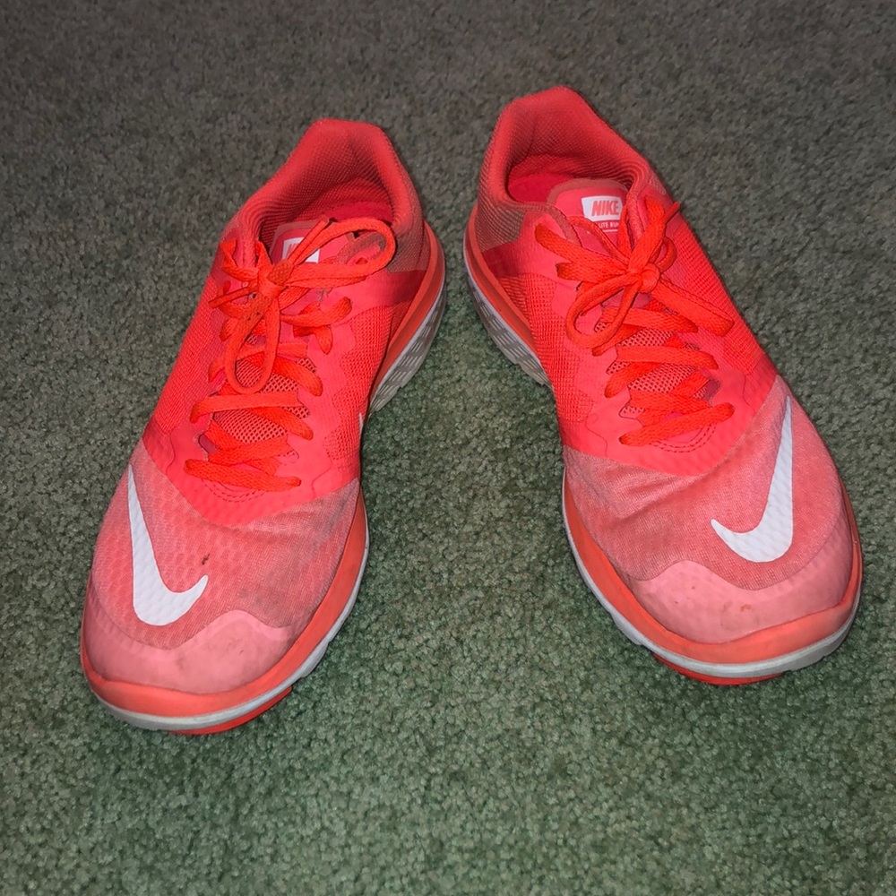 Bright orange Nike sneakers